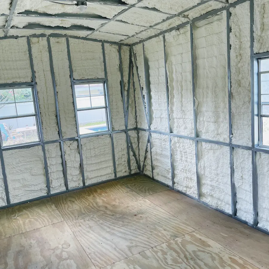 Closed-cell spray foam insulation applied to wall cavities in a residential project in Carrboro